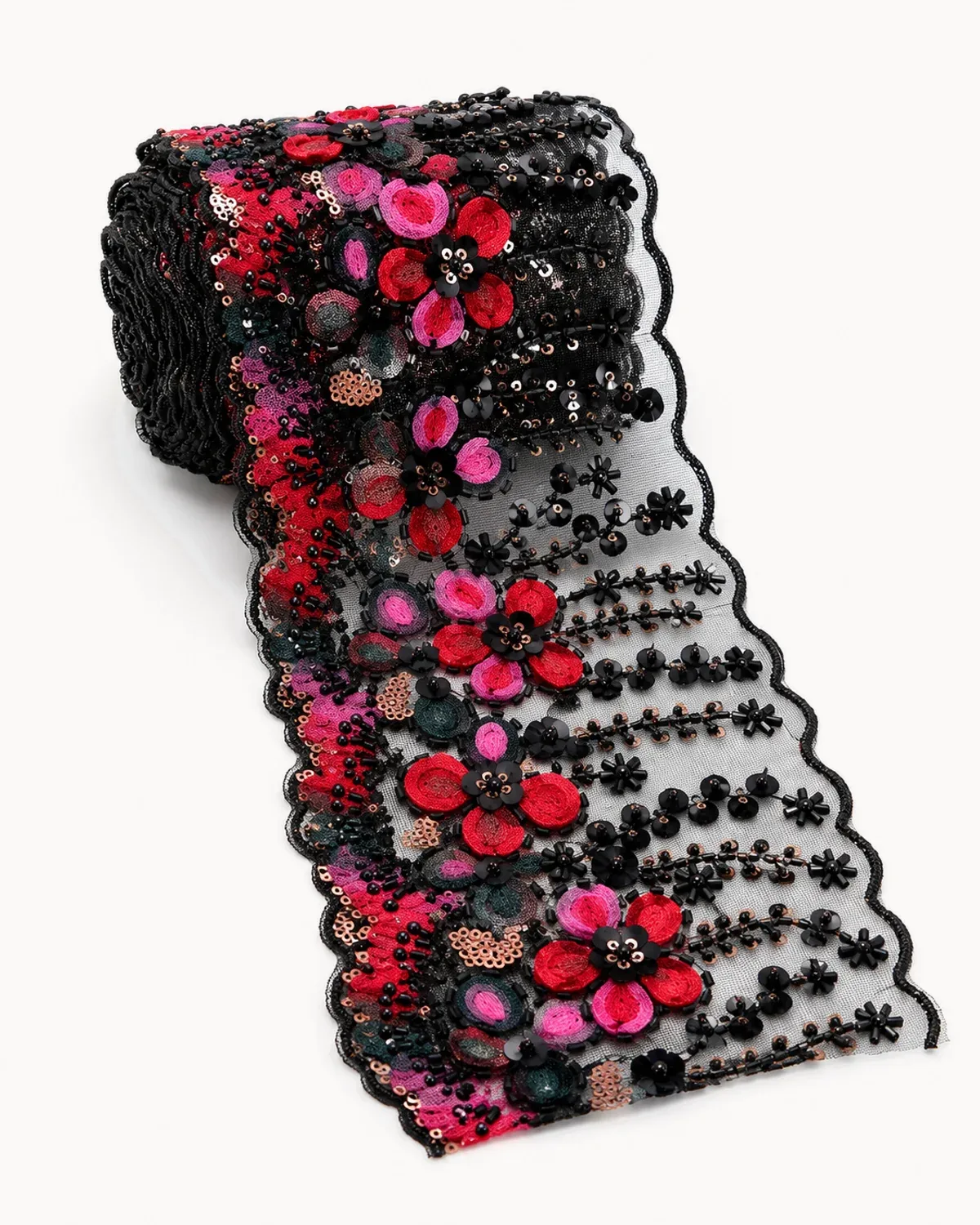 Roll of crimson and pink beaded floral lace trim