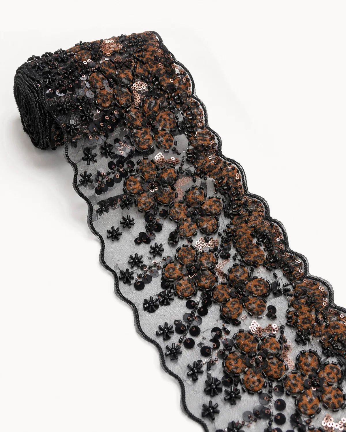 Roll of leopard-print beaded lace trim with copper sequins