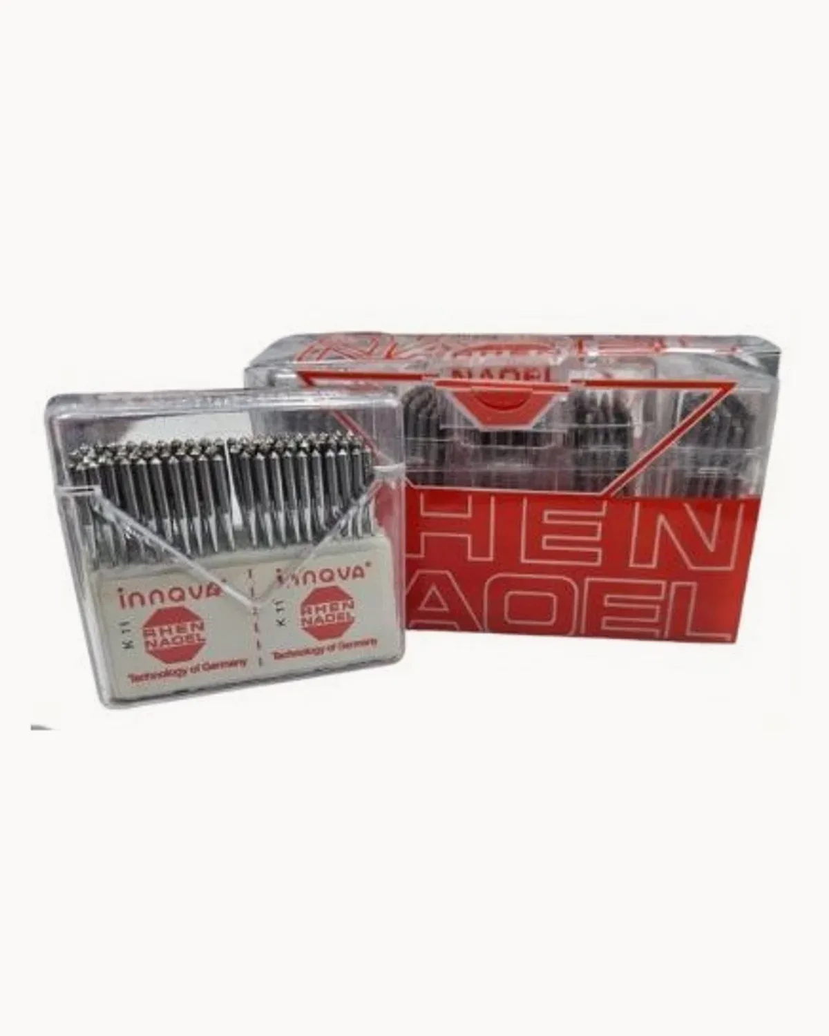A clear box of fine-shank lockstitch machine needles with its red carton