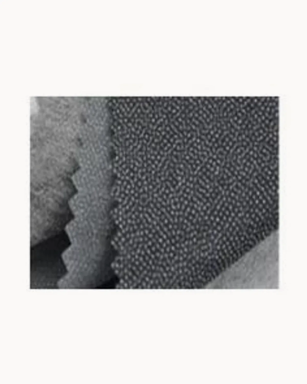 Close-up of grey micro-dot fusible interfacing showing the adhesive dots